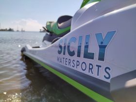 A close-up view of a jet ski from Sicily Watersports, showcasing the sleek design and vibrant colors, perfect for thrilling water adventures.