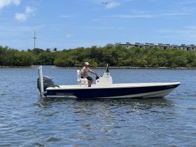 A Pathfinder speedboat navigates through calm waters, showcasing its sleek design and performance — perfect for fishing or leisure outings.