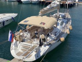 A beautiful yacht docked in a marina, showcasing its sleek design and elegant features, perfect for sailing enthusiasts.