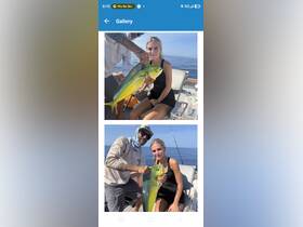 A young woman proudly displays her catch alongside a fishing guide, celebrating a successful day on the water — perfect for fishing enthusiasts and adventure seekers.