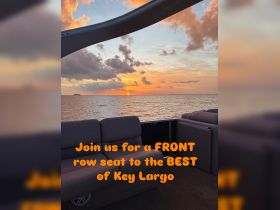 A serene sunset view from the front row seat of a boat in Key Largo, showcasing the tranquil waters and vibrant sky — perfect for evening cruises.