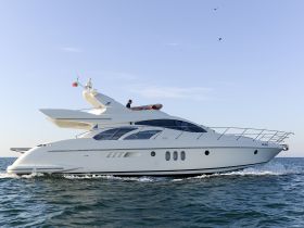 A sleek yacht cruising through the water, showcasing its elegant design and structure — perfect for luxury charters and ocean adventures.