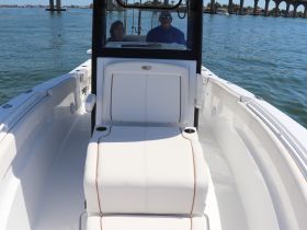 A spacious helm area featuring comfortable seating on a boat, perfect for enjoying a day on the water with friends or family.