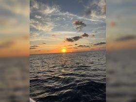 A stunning sunset over the ocean, capturing the serene beauty of the water and sky — perfect for romantic evening cruises or peaceful reflections.