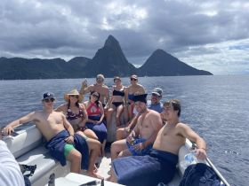 A cheerful group enjoys a day on the water, surrounded by stunning scenery — perfect for memorable boat trips and celebrations.
