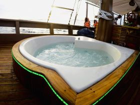 A luxurious jacuzzi on a boat, perfect for relaxation while enjoying scenic ocean views. Ideal for enhancing the onboard experience.