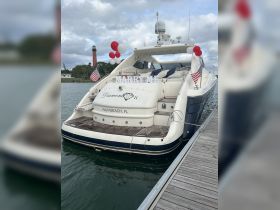 A beautifully decorated yacht named 'Diamond II' docked in Palm Beach, FL, featuring a romantic 'Marry Me' display, perfect for proposals or special celebrations on the water.