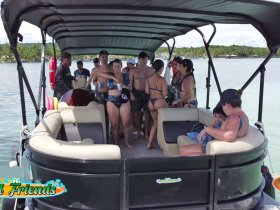 A lively group of friends enjoys a fun day on a boat, creating unforgettable memories together in the sun — perfect for summer outings and celebrations.