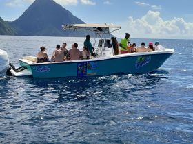 A lively group enjoys a day on the water aboard a boat, perfect for socializing and adventure in the ocean.