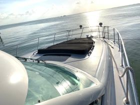 A stunning view of a yacht's bow, showcasing its sleek design against a serene water backdrop — perfect for luxury boating experiences.