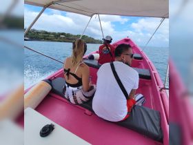 A group enjoys a scenic boat ride, capturing the essence of adventure on the water with friends.