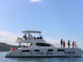 A lively group enjoys their time aboard the 'Lady Verr' yacht, showcasing a perfect blend of fun and relaxation on the water.