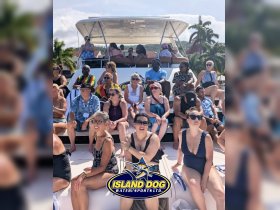 A lively group of guests enjoying their time aboard a boat, perfect for social gatherings and water adventures.