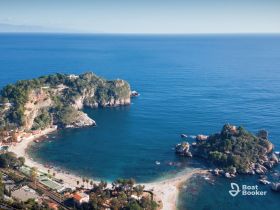 A stunning aerial view of a picturesque coastline featuring lush islands and clear blue waters, perfect for showcasing the beauty of seaside destinations.