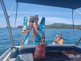 A lively group prepares for snorkeling, showcasing excitement and camaraderie on the water — perfect for adventure seekers and beach lovers.