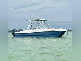 A sleek speedboat glides through clear turquoise waters, showcasing its elegant design and perfect for thrilling water adventures.