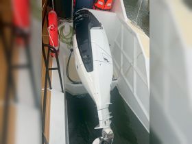 A close-up view of a boat engine, showcasing its sleek design and functionality — essential for any boating adventure.
