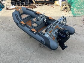 Aerial view of a sleek center console boat, showcasing its modern design and spacious layout, perfect for day trips on the water.