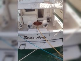The interior of the 'Strike Again' boat features a cozy seating area, perfect for relaxing while enjoying the beautiful waters of Nassau, Bahamas.