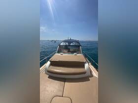 A clear view of the front deck of a boat, showcasing its sleek design and comfortable seating, perfect for enjoying a day on the water.