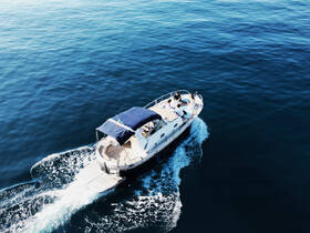 A group enjoys a scenic ride on a boat, cruising through calm waters — perfect for social outings and adventures on the sea.