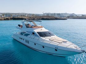 A stunning yacht named 'Muse' cruising through crystal-clear turquoise waters, perfect for luxurious outings and island adventures.