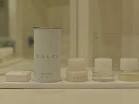 A neatly arranged welcome kit featuring CULTI bathroom amenities, perfect for enhancing guest experiences on board.