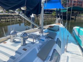 A well-equipped sailboat interior showcasing seating and helm areas, perfect for relaxing and navigating on the water.