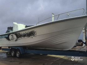 A sleek fishing boat is showcased on a trailer, highlighting its design and readiness for the water.