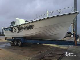 A fishing boat is docked and ready for adventure, showcasing its sleek design and sturdy build, perfect for a day on the water.