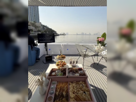 A beautifully arranged spread of snacks and refreshments on a boat, perfect for enjoying a relaxing day on the water with friends or family.