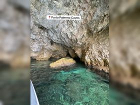A stunning view of the Porto Palermo Caves, showcasing the unique rock formations and crystal-clear waters, perfect for exploring the natural beauty of the coastline.