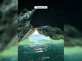 A stunning view from inside the Secret Cave, showcasing the vibrant turquoise waters beyond — a perfect spot for exploration and adventure.