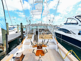 An inviting interior view of a yacht's helm and seating area, showcasing the spacious design and comfortable amenities perfect for a day on the water.