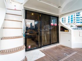 A glimpse into the interior of a luxurious yacht, showcasing the elegant staircase and modern design elements, perfect for comfortable cruising.