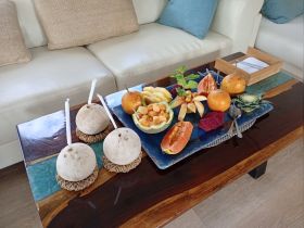 A beautifully arranged platter of fresh fruits and snacks, perfect for enjoying onboard during a relaxing day at sea.