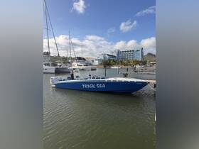 A vibrant blue speedboat named 'Trick Sea' docked at a marina, surrounded by other vessels and a scenic backdrop.