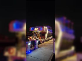 A beautifully lit boat named 'La Vie' docked at night, showcasing its modern design and vibrant colors — perfect for evening cruises and events.