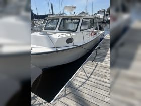 A well-maintained boat docked at the marina, showcasing its sleek design and readiness for adventure on the water.