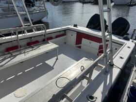 Interior view of a boat showcasing the seating area and helm, ideal for comfortable outings on the water.