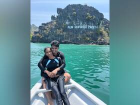 A couple enjoys a romantic moment on a boat at Kilim Geoforest Park, surrounded by stunning natural scenery — perfect for unforgettable adventures.