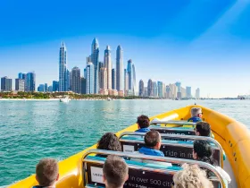 Guests enjoy a thrilling boat tour in Dubai, taking in stunning views of the iconic skyline and waterfront. Perfect for sightseeing and experiencing the city's vibrant atmosphere from the water.