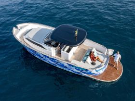 A couple enjoys a relaxing moment on a stylish boat, showcasing the perfect setting for a day on the water.