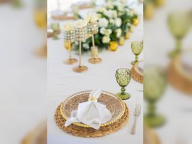 An elegant table setting featuring decorative glassware and floral arrangements, perfect for upscale dining experiences on a boat.