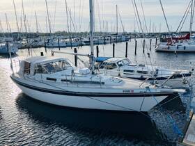 A beautiful yacht docked at the marina, showcasing its sleek design and surrounding boats — perfect for a day on the water.