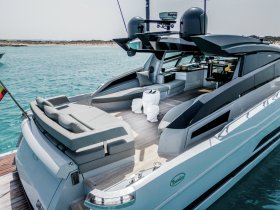 A stylish interior view of a luxury yacht showcasing comfortable seating and modern amenities, perfect for relaxing on the water.