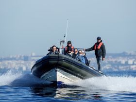 A lively group enjoys a thrilling ride on a boat, showcasing the excitement of on-water adventures with friends.