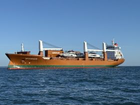 The cargo ship SPUIGRACHT is seen underway, transporting yachts across the water — a vital part of maritime logistics.