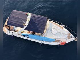 Aerial view of guests relaxing on a boat, enjoying the sun and sea — perfect for a day of leisure on the water.