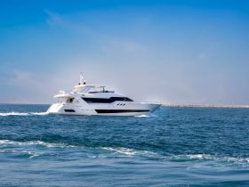 A stunning yacht cruising through clear waters, showcasing its sleek design and elegance — perfect for luxury charters and coastal adventures.